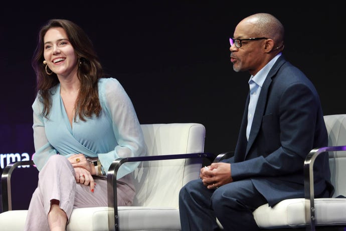 Cathryn Peirce and David Penn sit on conference stage